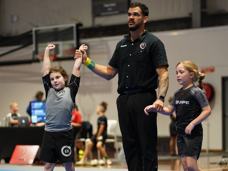 Young Studio 55 student celebrating a win at a kids Brazilian Jiu Jitsu competition